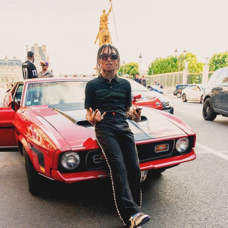 Swae Lee poses with a Mustang Mach 1 car in Paris in June. Photo: @swaelee/Instagram