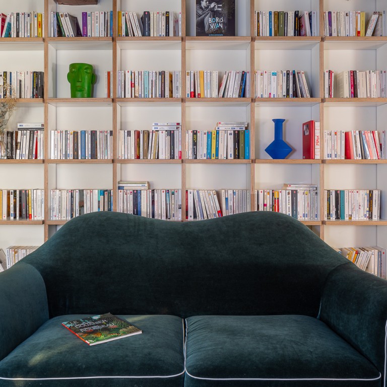 Books and vinyls on wooden shelves in a suite at Chouchou Hôtel in Paris. Photos: Handout