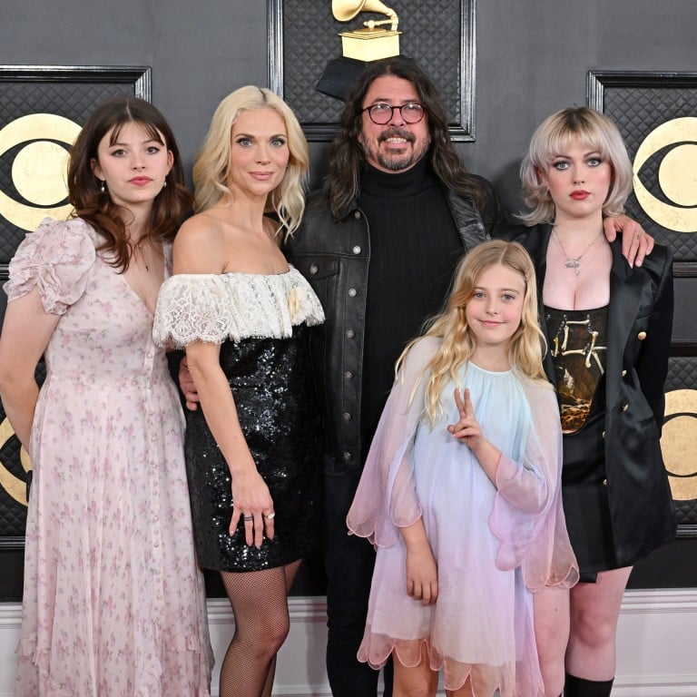 Dave Grohl with his wife Jordyn Blum and three daughters, Ophelia, Harper and Violet, at the 2023 Grammys. Photo: Getty Images