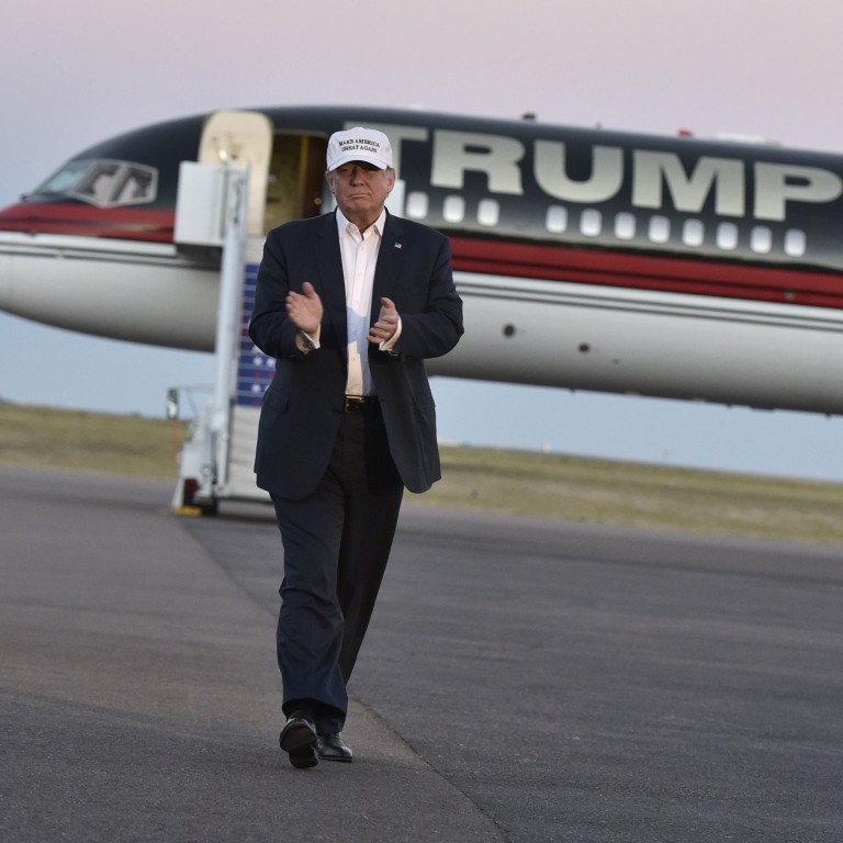 Donald Trump with his private jet, dubbed Trump Force One, in 2016. Photo: Getty Images