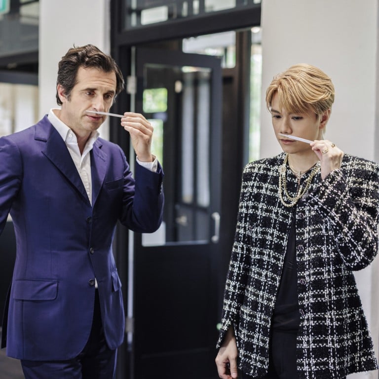 Olivier Polge (left), the fourth in-house master perfumer in Chanel’s history, samples scents with singer Hins Cheung in Singapore. Photo: Handout