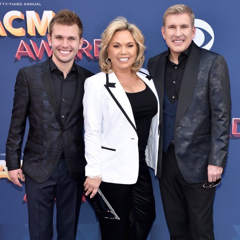 Reality TV’s Chase Chrisley, with parents Julie Chrisley and Todd Chrisley, before the couple was jailed. Photo: Getty Images