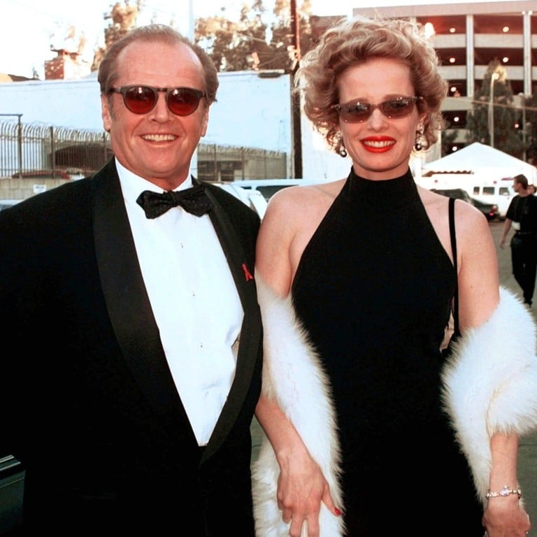 Jack Nicholson, nominated for Best Actor for As Good As It Gets, arrives with Rebecca Broussard at the 70th Academy Awards in Los Angeles in 1998. Photo: AP