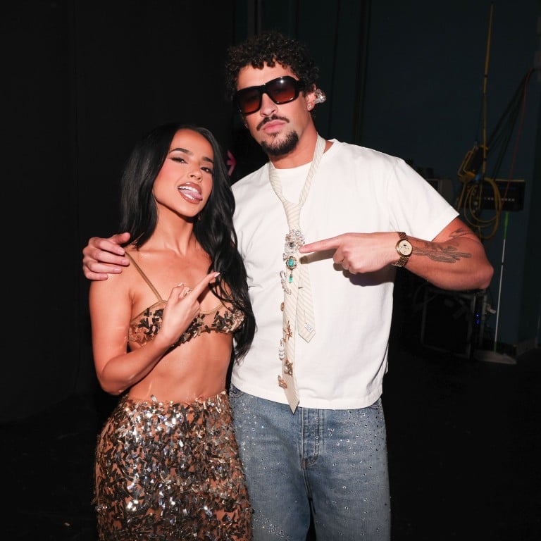 Seen here with Becky G, Bad Bunny bossed the 2025 iHeartRadio Music Awards on March 17, winning an award and performing in a Storm Pablo-styled outfit of white fur coat, jeans and tie, accessorised with pearls and a Vacheron Constantin watch. Photo: Getty Images