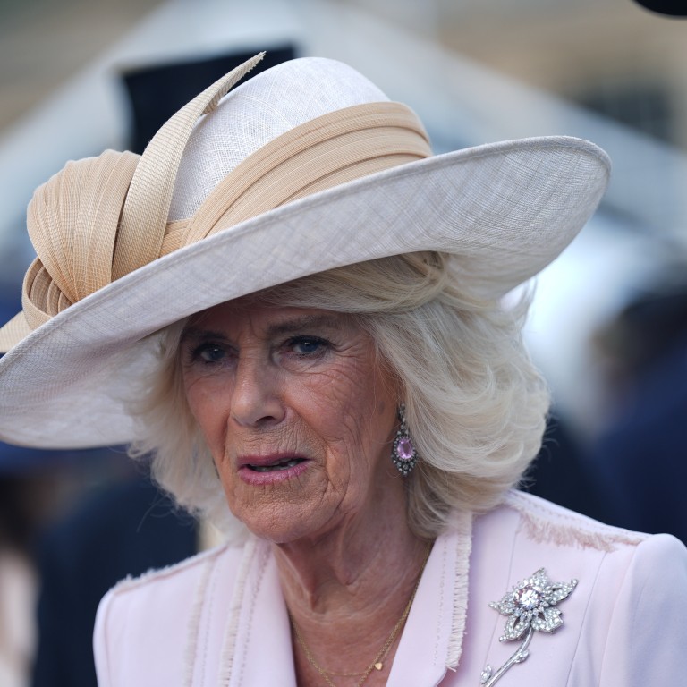 Queen Camilla wearing the late Queen Elizabeth’s Williamson Diamond brooch by Cartier at a Buckingham Palace garden party last May. Photo: Getty Images