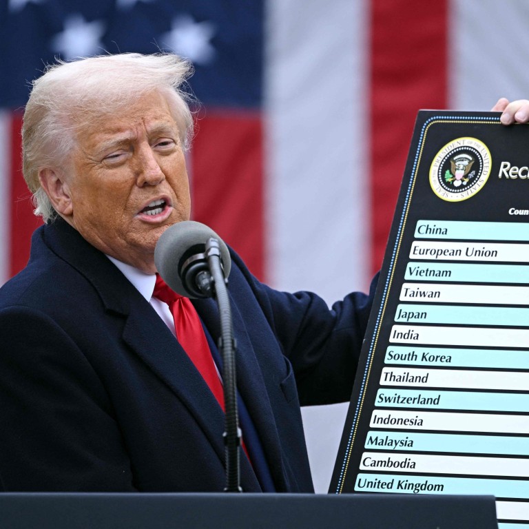 US President Donald Trump holds a chart as he delivers remarks on tariffs at the White House on April 2. Photo: AFP
