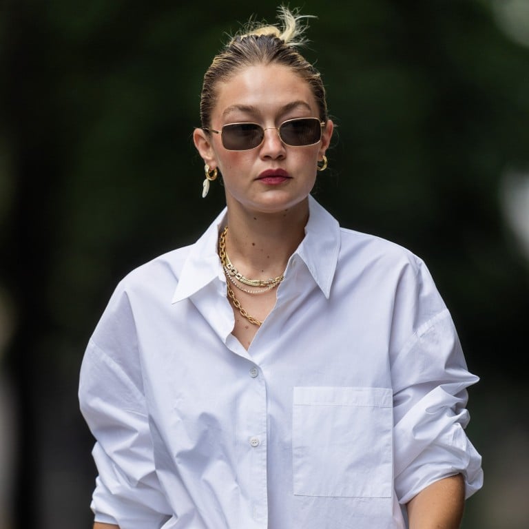 Gigi Hadid layered several gold chain necklaces while out and about in New York in August 2023. Photo: GC Images