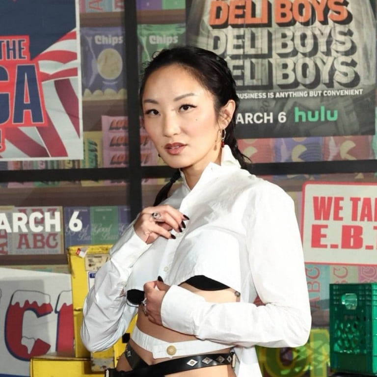 Poppy Liu in front of a poster for the Hulu show Deli Boys in 2025. Photo: @poppyliu/Instagram