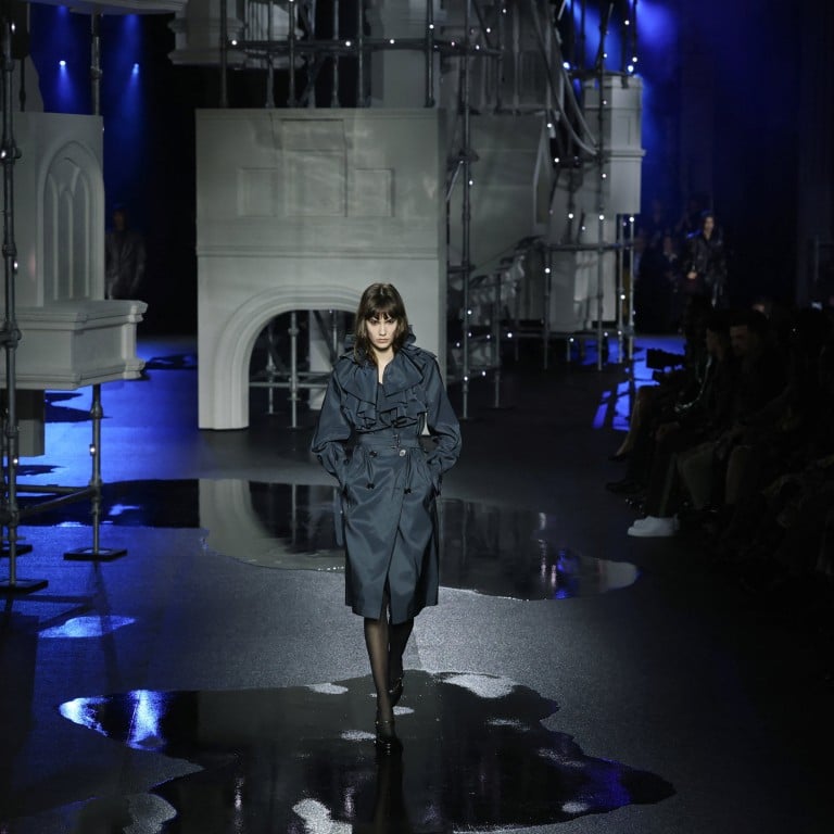 The rain-soaked runway at the Burberry fall/winter 2026 show. Photo: Reuters