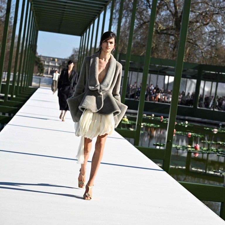 The stunning set of the Dior fall/winter 2026 show featured an artificial pond filled with water lilies. Photo: AFP