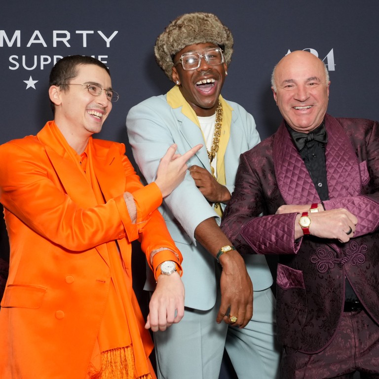 Timothée Chalamet, Tyler the Creator and Canadian businessman Kevin O’Leary show off watches with coloured straps at December’s New York premiere of Marty Supreme. Photo: Variety via Getty Images