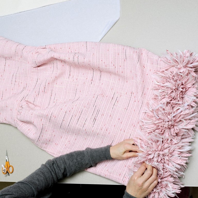 Le19M, Chanel’s new, purpose-built site dedicated to the métiers d’art, houses hundreds of artisans, including flower-making specialist Lemarié – shown here preparing a garment during the making of Chanel’s Métiers d’Art 2026 collection. Photo: Handout