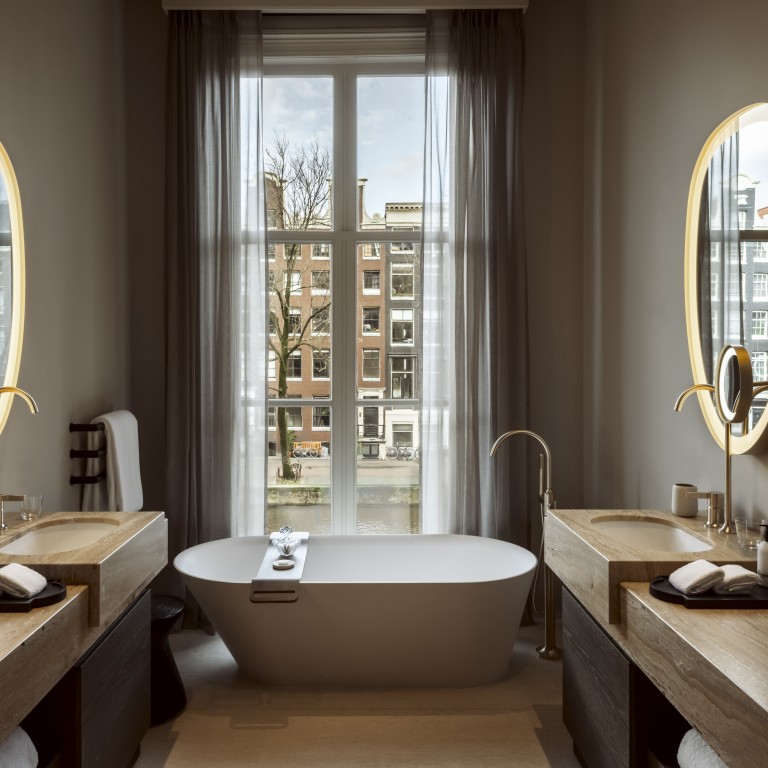 A bathroom in a suite overlooking a canal at Rosewood Amsterdam. Photo: Handout
