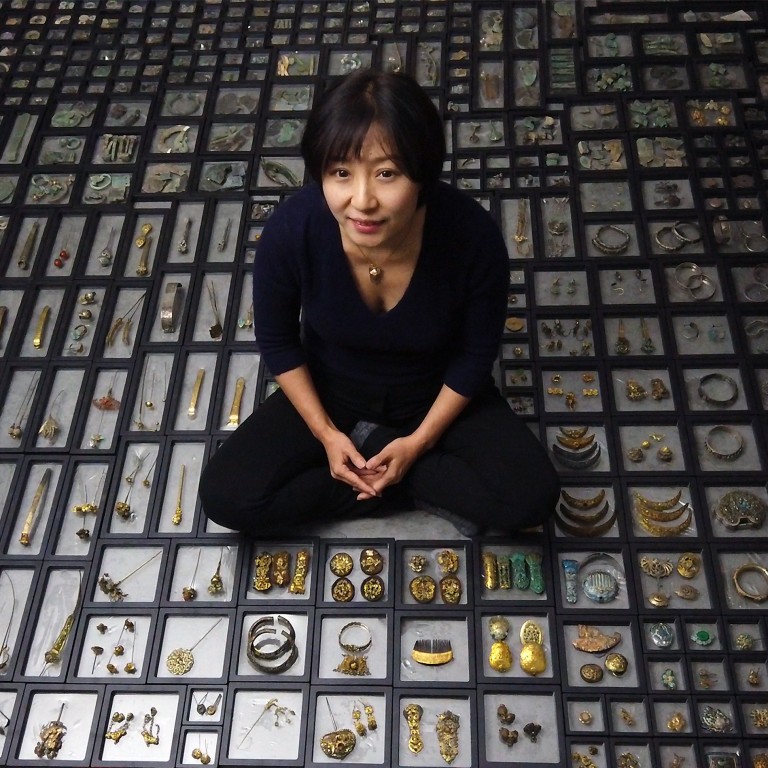 Chinese jeweller Huimin Zhang with her collection of antique jewellery. Photo: Handout