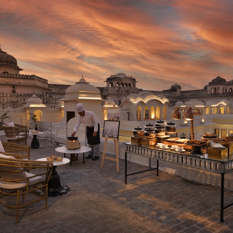 The high tea at Ran Baas, The Palace in India against a fiery sky. Photo: Handout