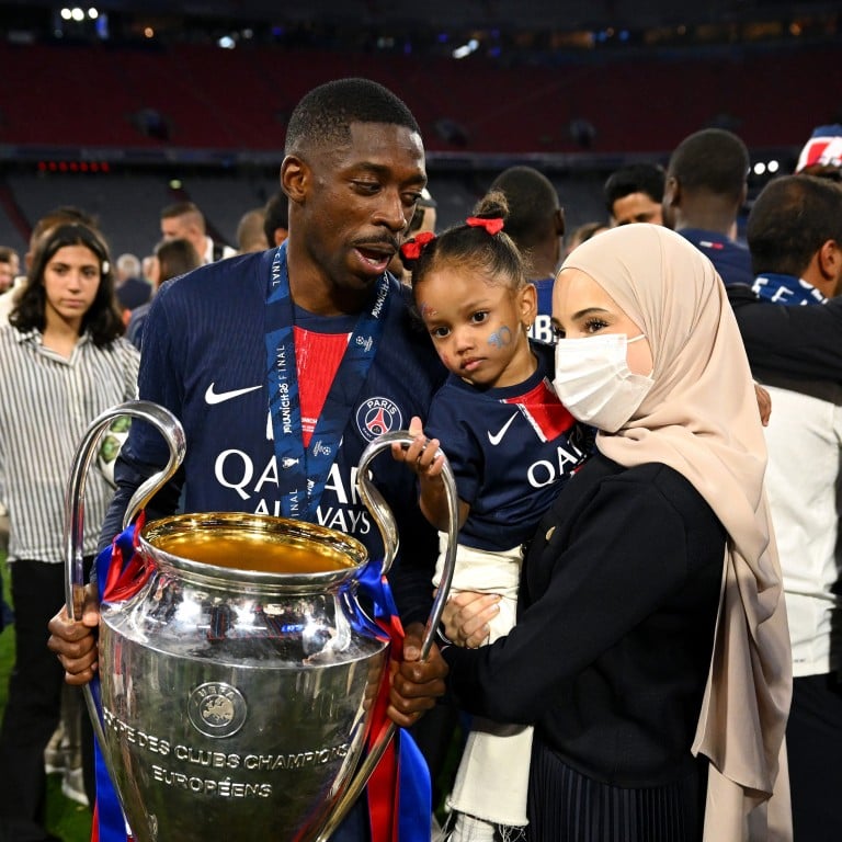 Ousmane Dembélé with his wife, Rima Edbouche, and daughter after his team Paris Saint-Germain’s victory at the UEFA Champions League Final last May. Photo: Getty Images