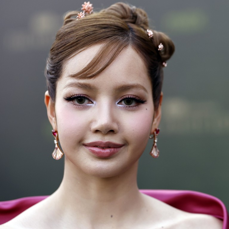 Blackpink’s Lisa was pretty in pink and a Y2K-inflected updo, accessorised with jewellery including tiny lotus flower hair embellishments, at the premiere of The White Lotus season three in Bangkok last year. Photo: EPA-EFE