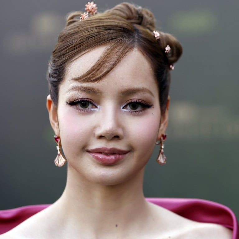 Blackpink’s Lisa was pretty in pink and a Y2K-inflected updo, accessorised with jewellery including tiny lotus flower hair embellishments, at the premiere of The White Lotus season three in Bangkok last year. Photo: EPA-EFE