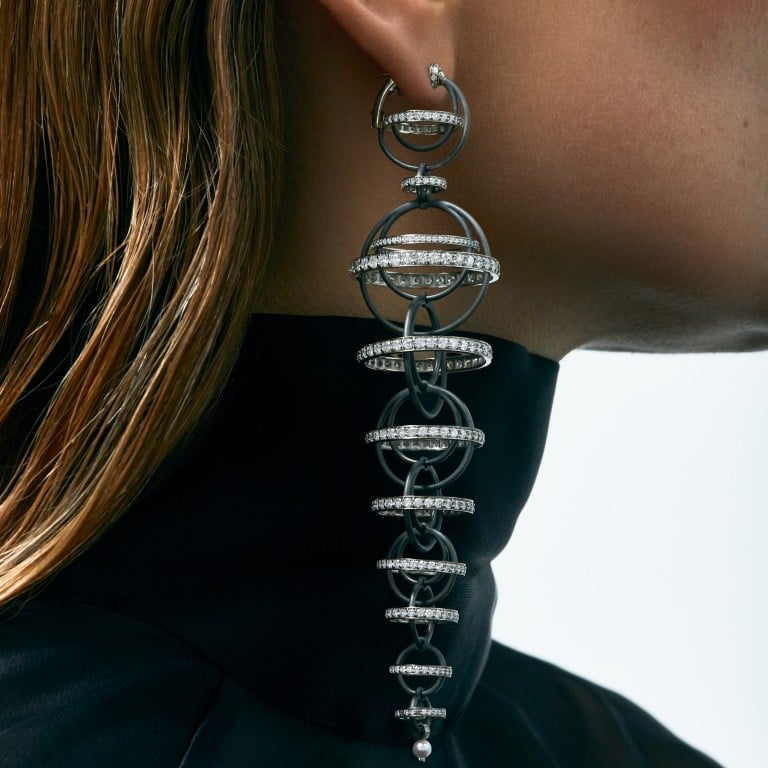 Flow earrings in titanium and 14k palladium gold, set with diamonds, blue sapphires and a pearl, by Inesa Kovalova. Photo: Handout