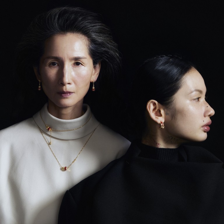 On Christina: earrings, necklaces Chow Tai Fook; top Issey Miyake. On Shiro: earring Chow Tai Fook; top Issey Miyake. Photography: Olivia Tsang