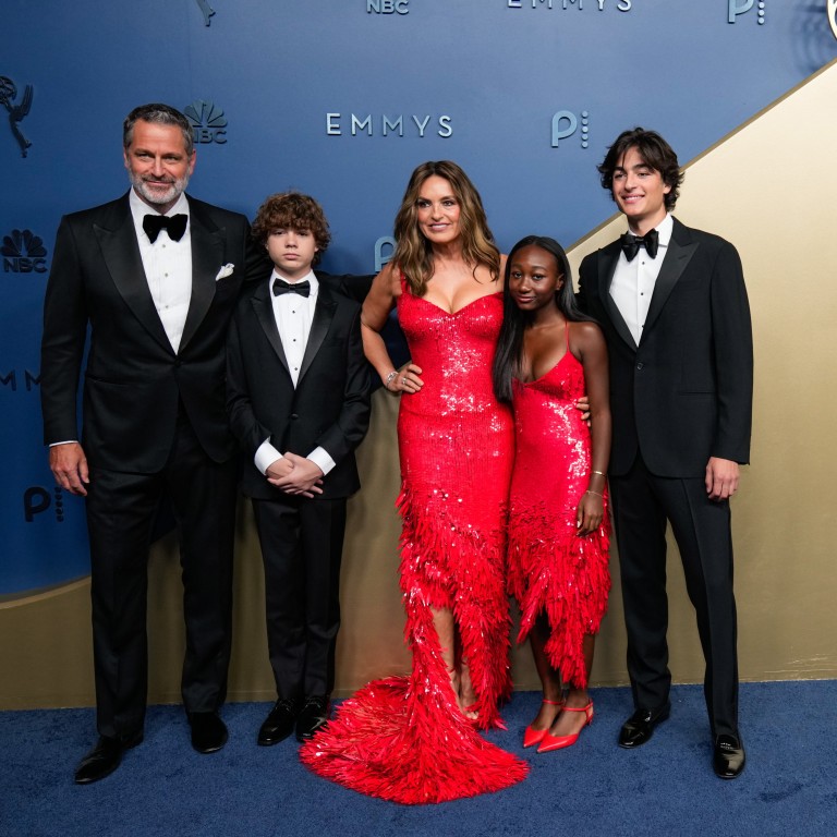 Mariska Hargitay (centre) and her daughter, Amaya, wear matching red dresses at the 78th Emmy Awards on September 14, while her husband, Peter Hermann (left), and their sons don sharp black suits. Photo: AP Photo