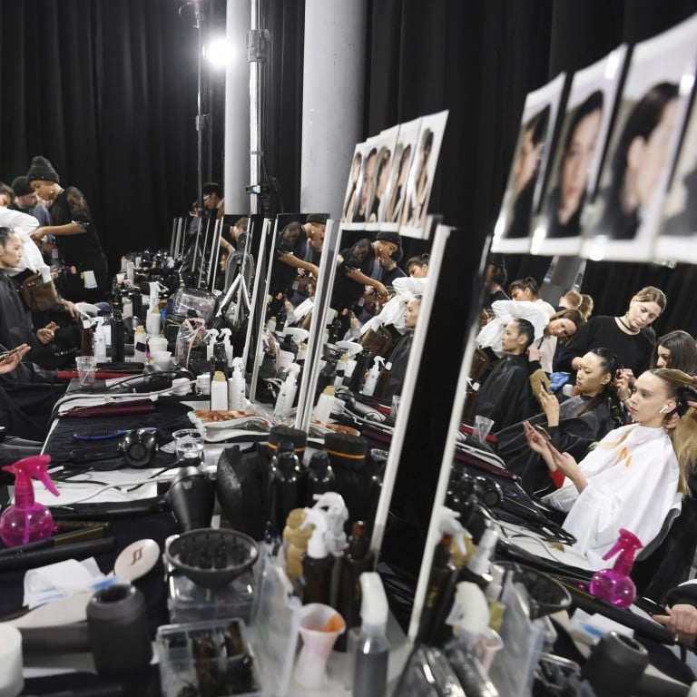 Models prepare backstage before the Shiatzy Chen autumn/winter 2019/20 collection show at Paris Fashion Week. Photo: AFP