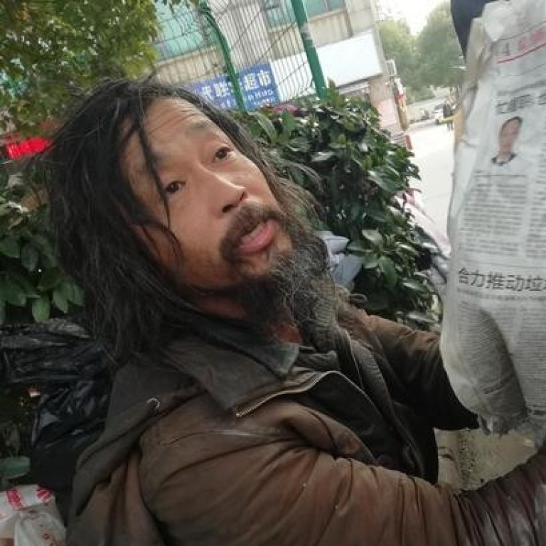 Shanghai, China. 30th Oct, 2006. A homeless man, with his
