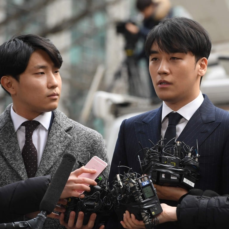 K-pop star Seungri (centre), who has quit the boy band Big Bang and resigned from show business after being embroiled in a sex and drugs scandal in South Korea. Photo: AFP