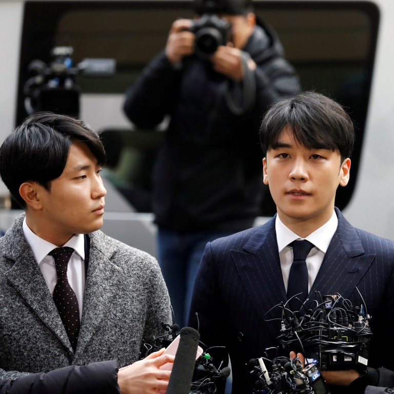K-pop star Seungri (centre), who has quit the boy band Big Bang and resigned from show business after being embroiled in a sex and drugs scandal in South Korea. Photo: Reuters