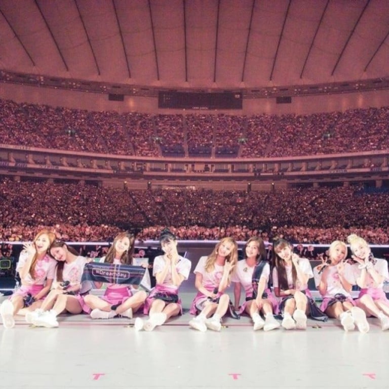 The nine-member K-pop girl group TWICE poses for a photograph in front of fans at the sold-out Tokyo Dome at one of its concerts in the Japanese capital, held last Friday and Saturday. Photo: JYP Entertainment