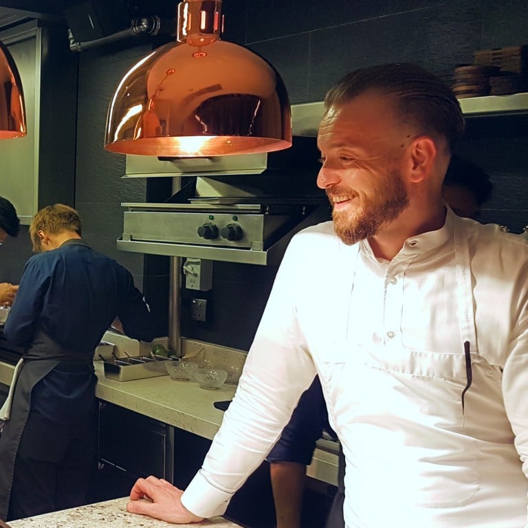 Restaurant Zen’s head chef, Tristan Farmer, presides over his kitchen. The three star restaurant already has a three month waiting list for reservations. Photo: Cedric Tan