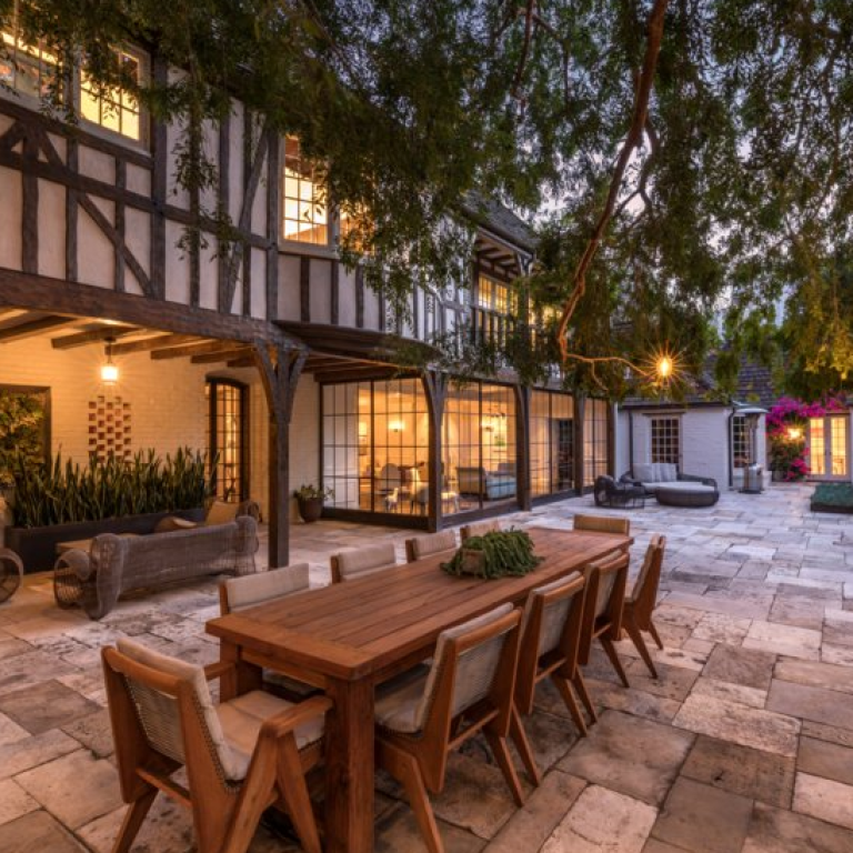 Brad Pitt and Jennifer Aniston’s former French Normandy Revival-style home, which is for sale in Beverly Hills, California, includes a spacious outdoor area for dining and entertaining. Photo: Hilton & Hyland