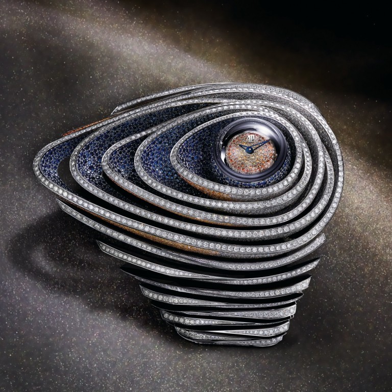 Audemars Piguet’s Haute Joaillerie Sapphire Orbe sports a dial that is set on an orb that can be turned over and hidden within the spacecraft-like bracelet.