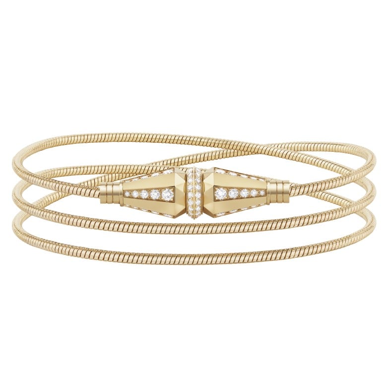 Jack de Boucheron’s three wraps bracelet is half-paved with diamonds in yellow gold. Boucheron worked for more than two years to perfect a ingenious new clasp mechanism that fastens like an auxiliary jack.