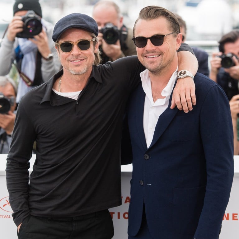 Brad Pitt and Leonardo DiCaprio attend a photocall for Once Upon A Time In Hollywood with Pitt wearing a Breitling watch.