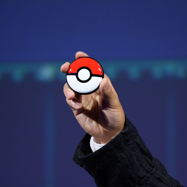A Pokemon Go Plus + device is presented during a Pokemon Co. event in Tokyo on Wednesday. Pokemon Co., partly owned by Nintendo Co., unveiled several new initiatives at the event, including a Detective Pikachu sequel for the Switch console and a device for tracking sleep. Photo: Bloomberg