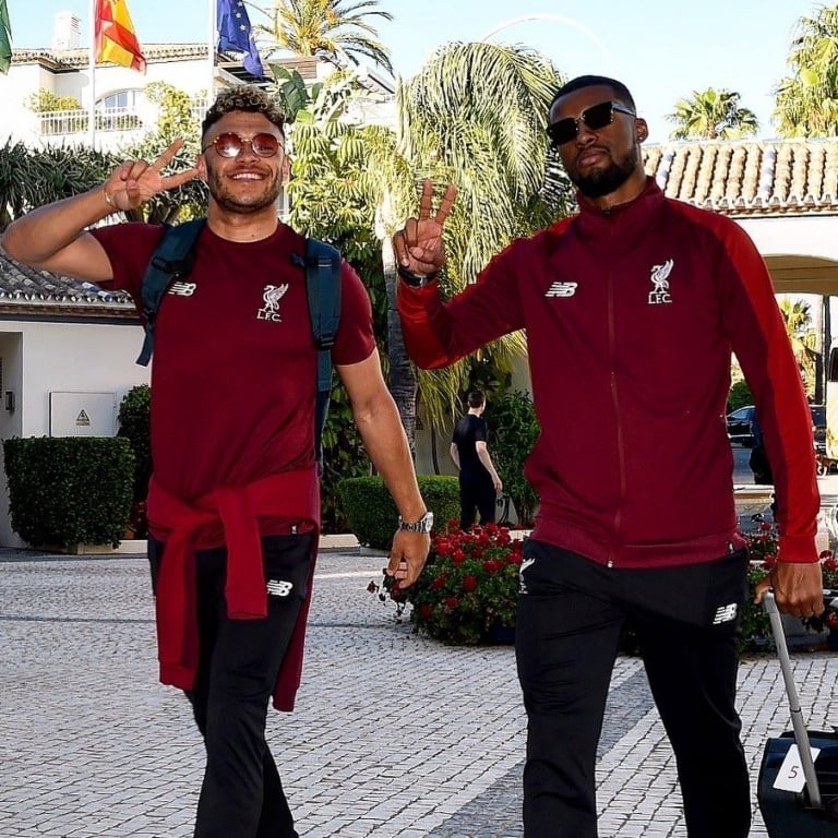 Liverpool players Alex Oxlade-Chamberlain and Georginio Wijnaldum greet the press photographers in Spain as they prepare for the Uefa Champions League final. Photo: Liverpool FC/Instagram