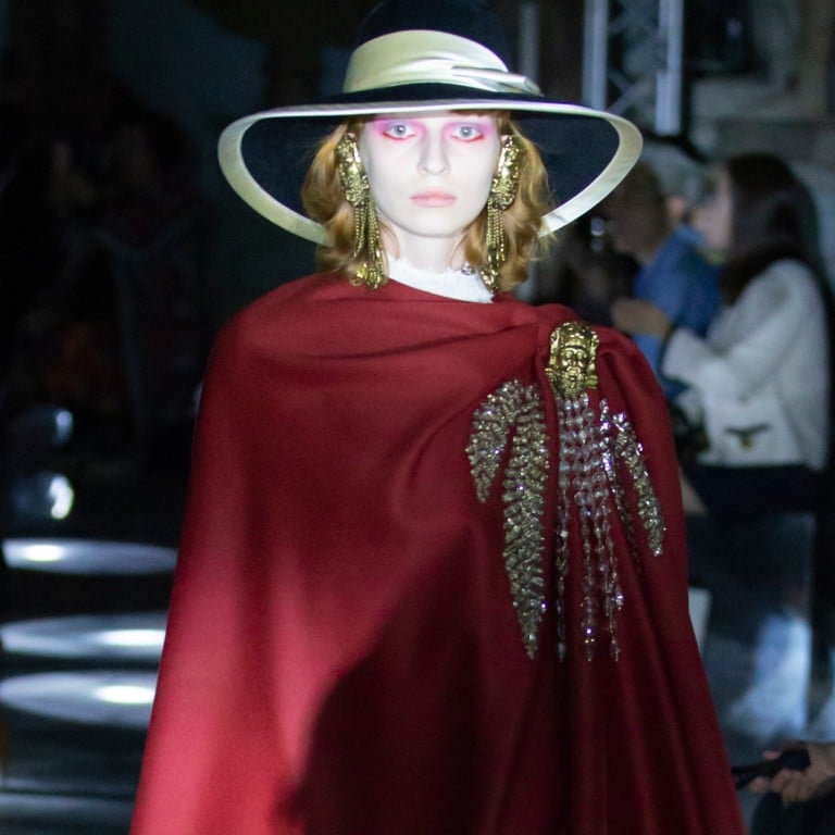 A model presents creations from the Gucci Cruise 2020 collection show at the Palazzo Nuovo at the historic Capitoline Museum in Rome.