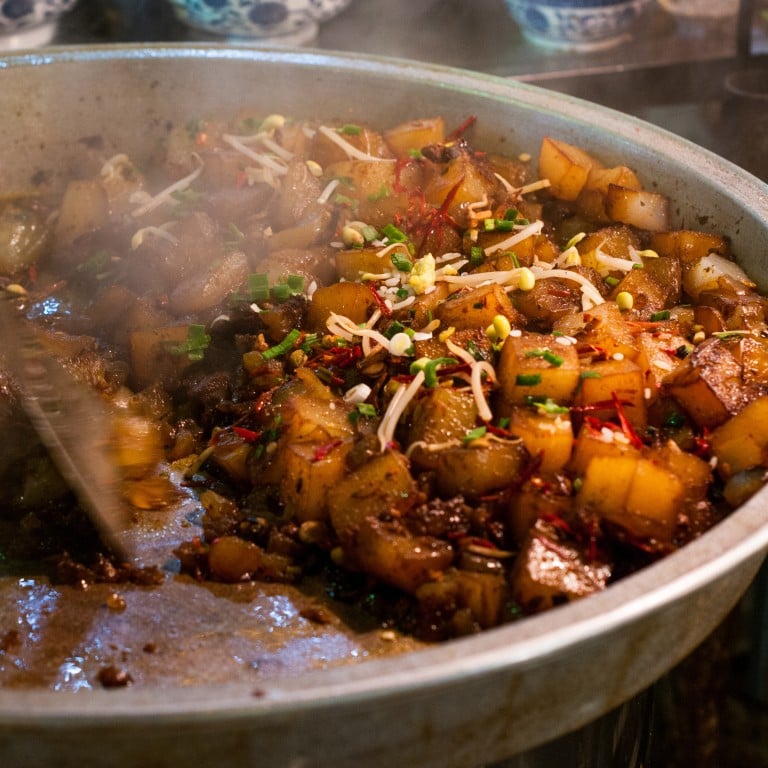 Cubes of fried liangfen (green bean jelly) cooking outside a restaurant in the Muslim Quarter in Xian. The backstreets of the Muslim Quarter are home to some of the best street food restaurants in the city.