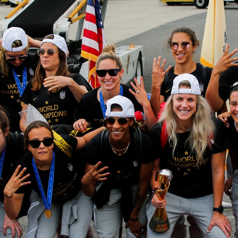 United States women soccer players celebrate as they return home to Newark International Airport in New Jersey with the Fifa World Cup. Photo: Reuters