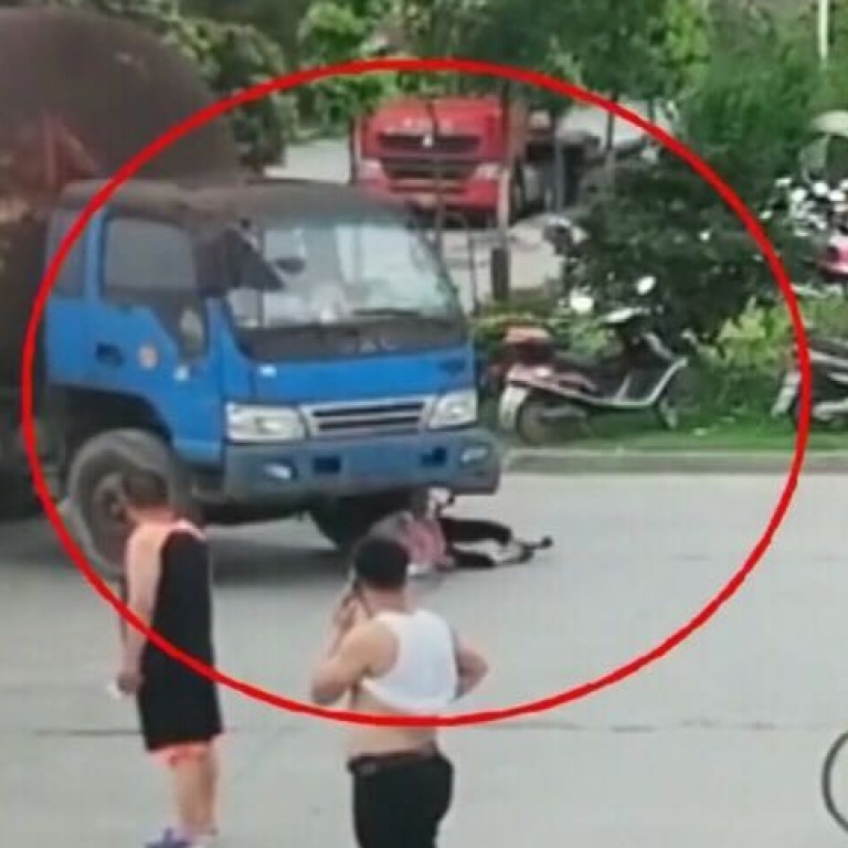 Chinese woman caught on camera faking road accident in bid to win