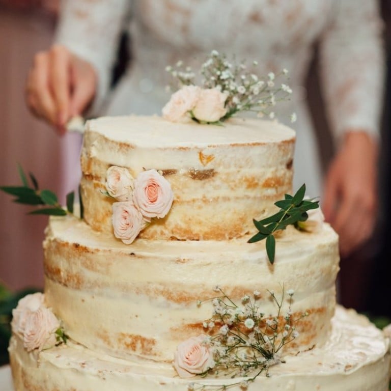 American newlyweds pay an average of US$550 for the cake on their wedding day, but that is far from being the biggest expense when getting married, a new study shows. Photo: Ruslan Shramko/Shutterstock