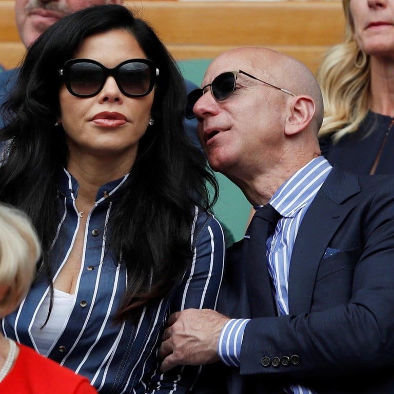 Jeff Bezos (right) with Lauren Sanchez as they watch Saturday’s men’s singles tennis final at the Wimbledon tennis championships in England. Photo: Reuters
