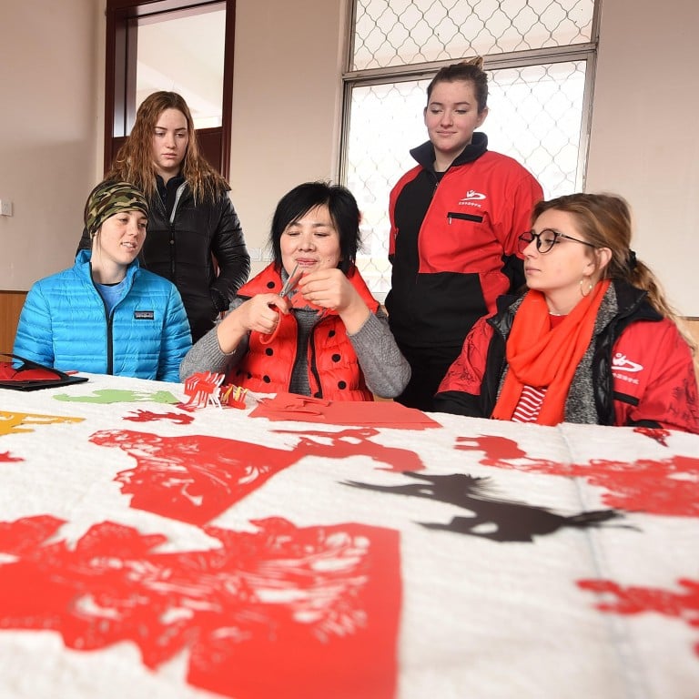 International students in China experience the traditional art of paper-cutting as part of their introduction to Chinese culture. Province. Photo: Alamy