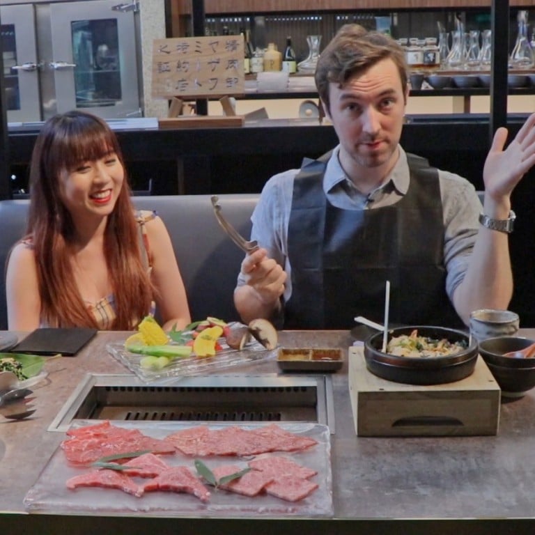 Avowed vegan Lim Li Ying (left) and her meat-eating colleague Douglas Parkes have a meal at the meat grill Yakiniku Jumbo in Central, Hong Kong.