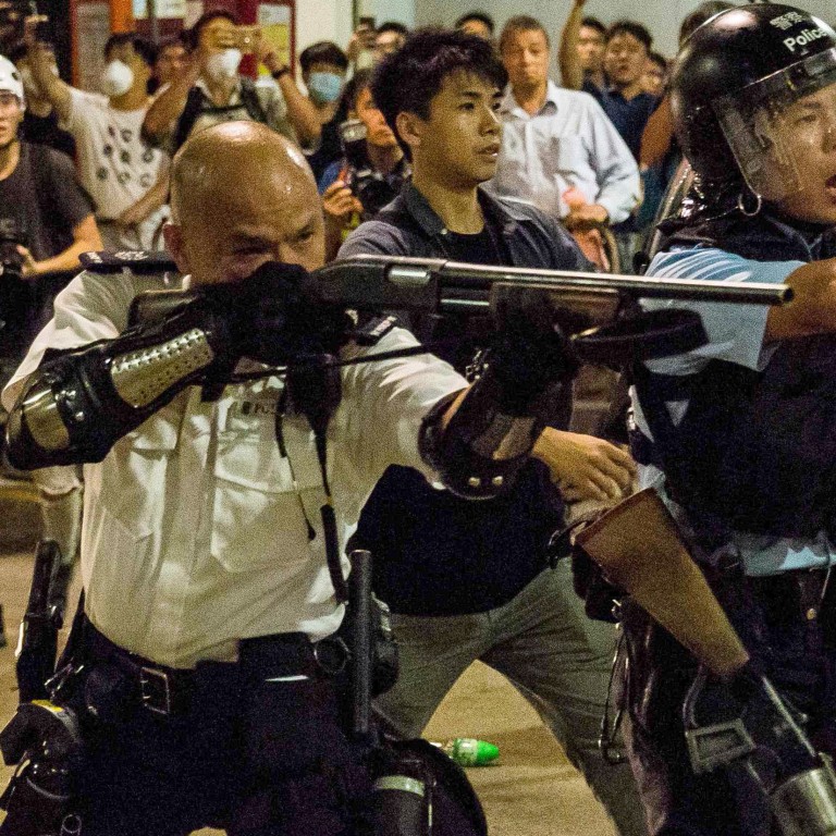 hong kong photo gun at head