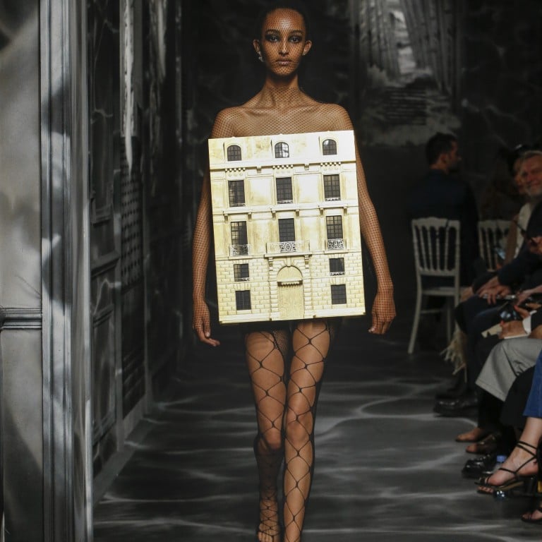 The Christian Dior couture show, held at 30 Avenue Montaigne, closes with an outfit featuring a golden dollhouse.