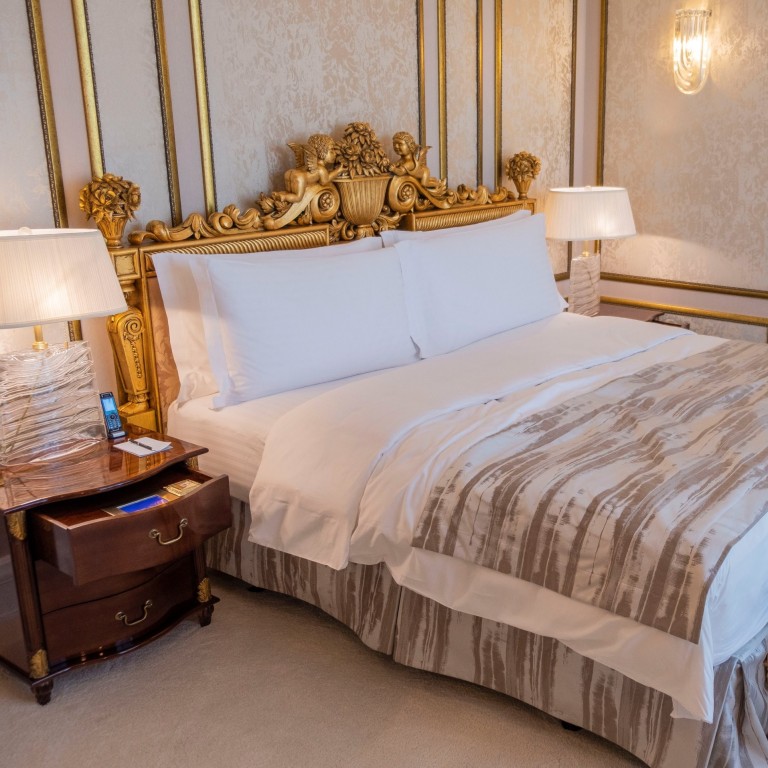 The Ritz-Carlton presidential suite bedroom in Moscow costs US$18,000 a night and is lavishly decorated in gold tones. Photos: Katie Warren/Business Insider