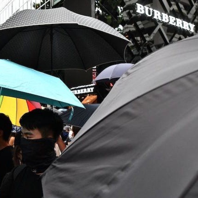 Protesters outside a Burberry store in Tsim Sha Tsui, Hong Kong. The brand may lose as much as US$122 million from the protests. Photo: Agence France-Presse/Getty Images