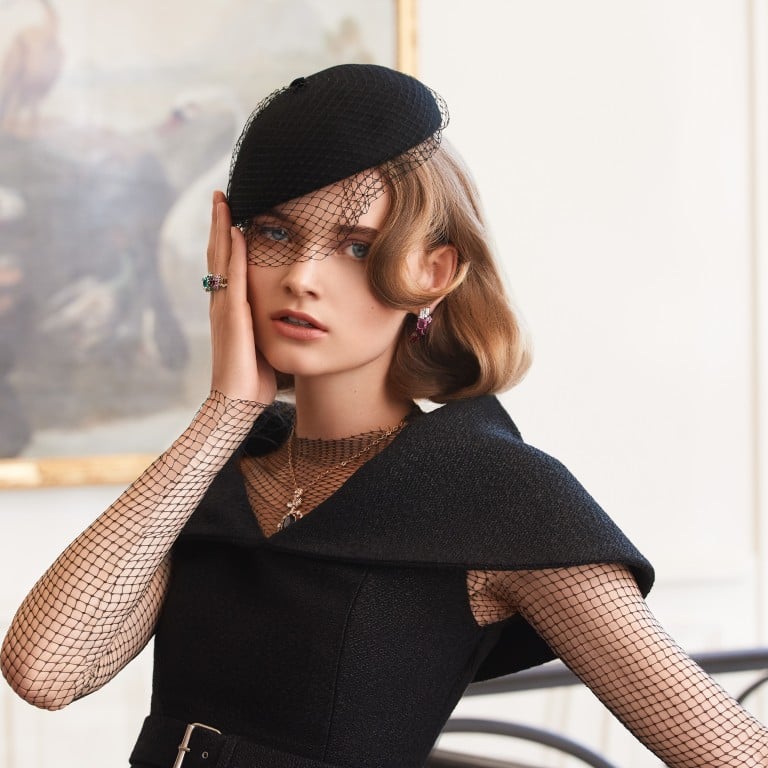 Dior haute couture dress, mesh T-shirt, wool basket weave top and leather belt, paired with Dior Joaillerie earrings, necklace, ring and double ring.